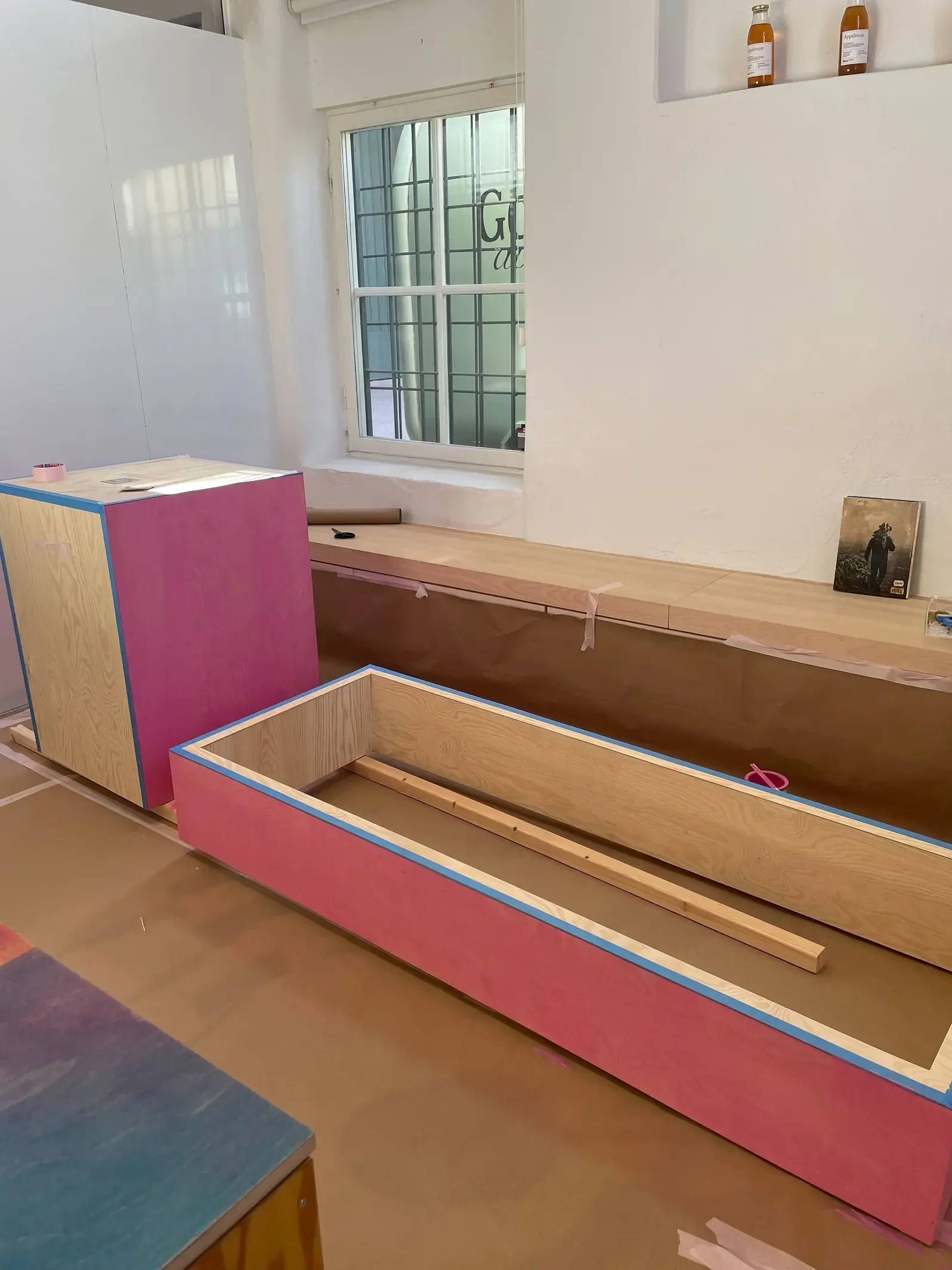 Pink podiums and boxes in construction