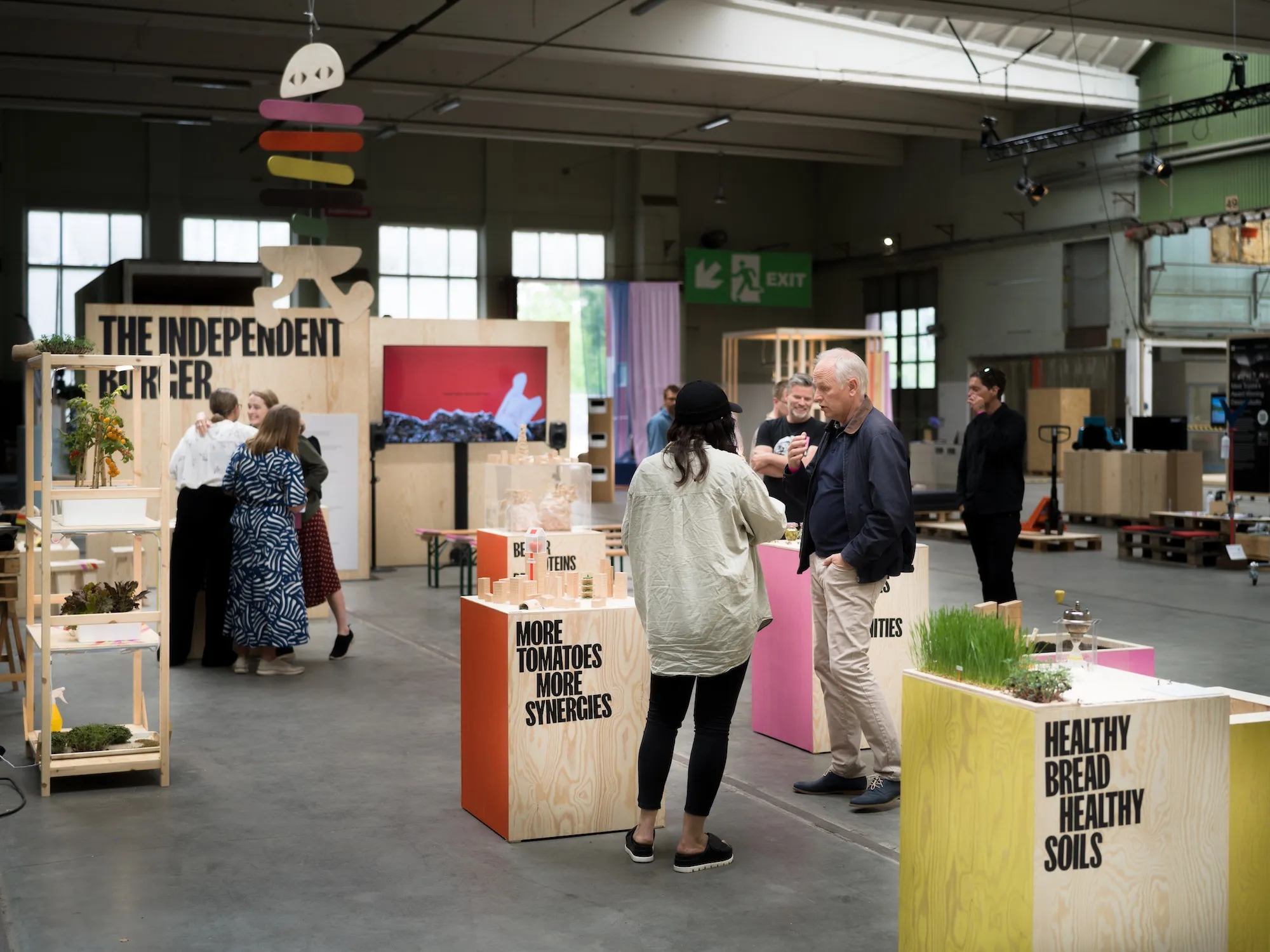 Exhibition space with podiums and people