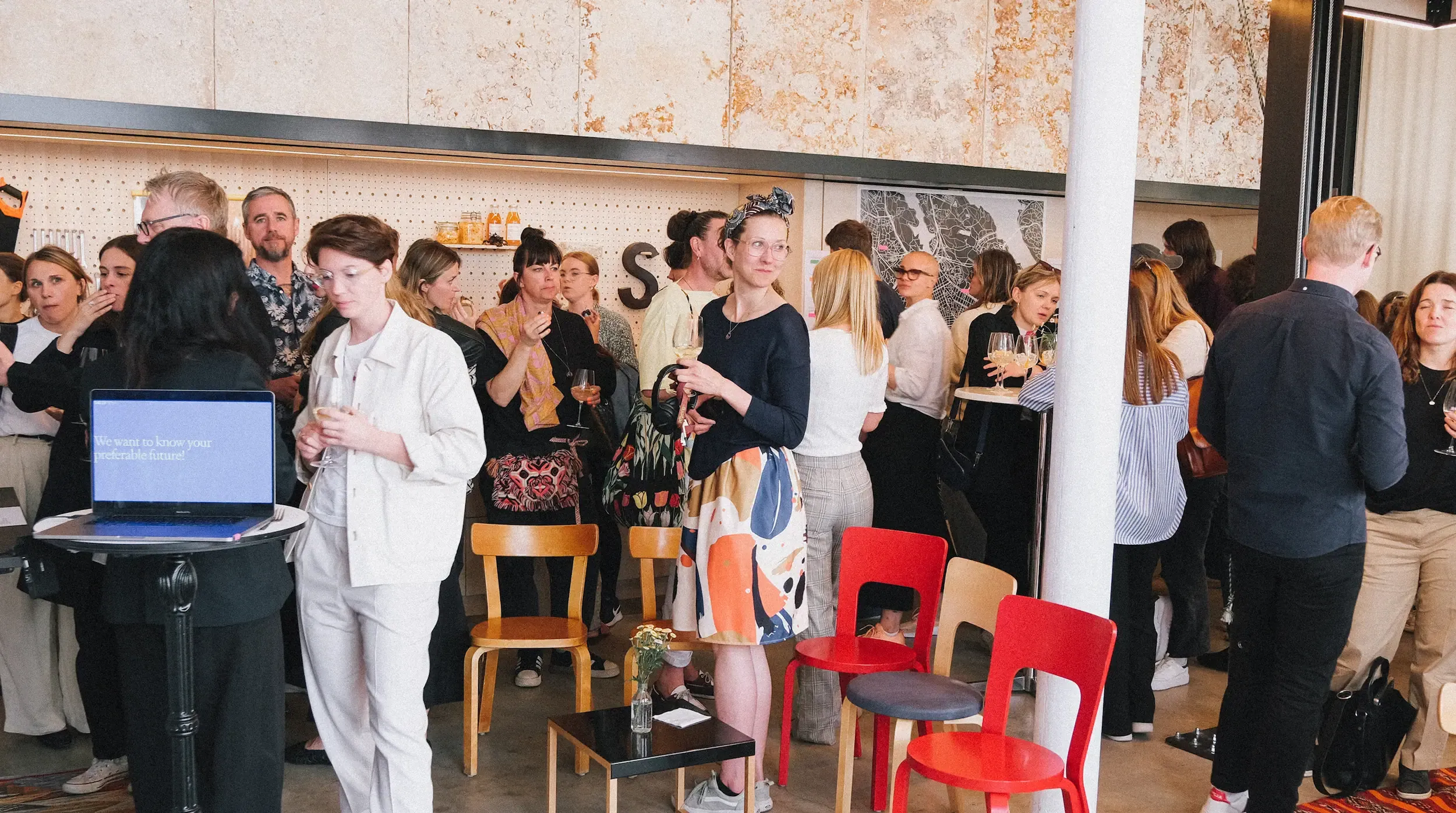 A crowd of people in the Sally space in the EY Doberman office